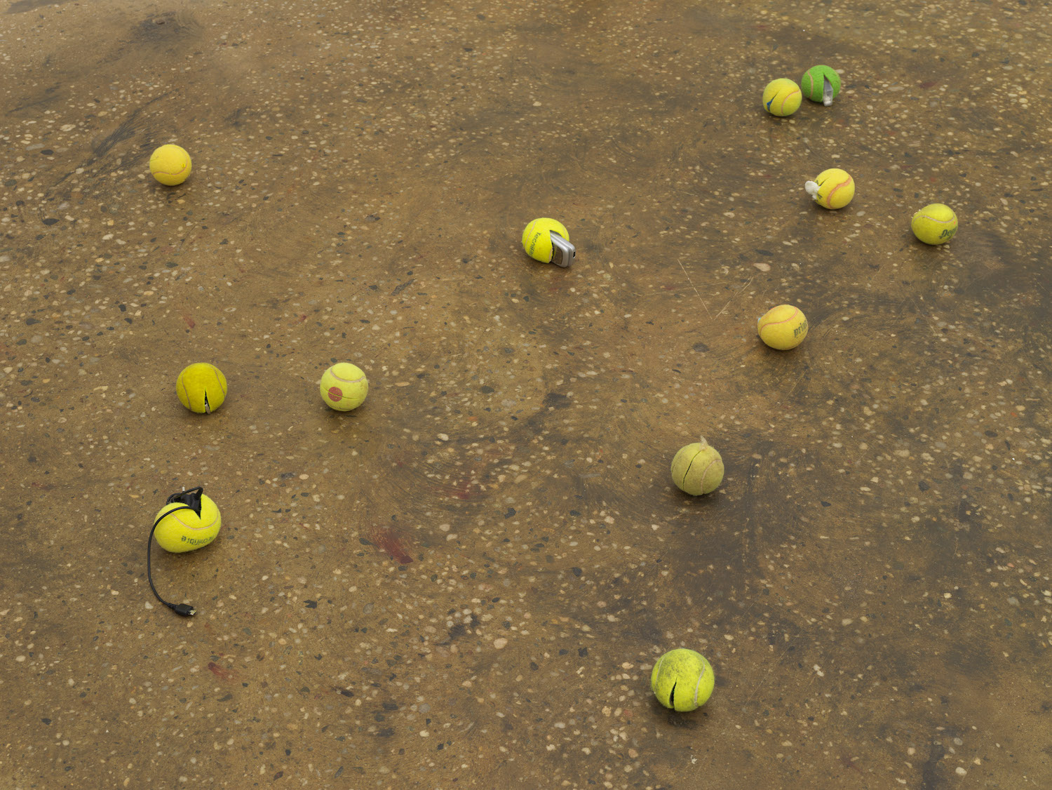 Smuggled into Claire Fontaine’s ‘Untitled (Tennis Ball Sculpture)’